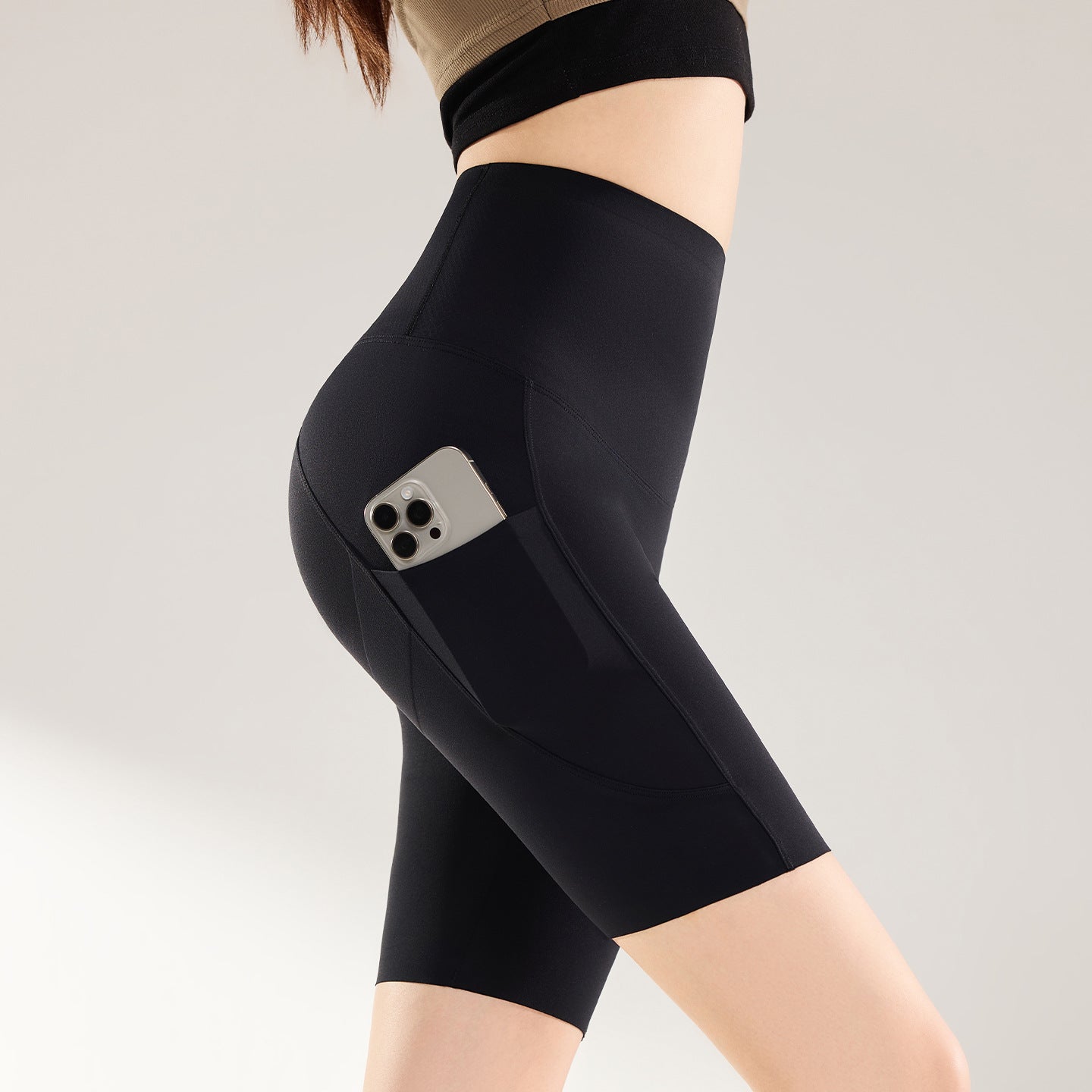 KIRAWear PocketForm High-Rise Biker Short in Black luxury sculpting activewear